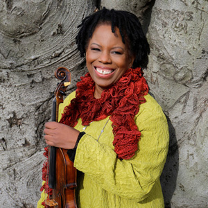 Regina Carter holding violin