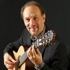 Photo of William Kanengiser posing with his guitar.