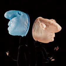 Two Mummenschanz performers on stage.
