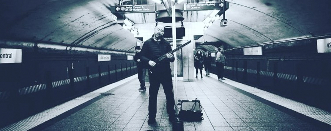 black and white image of Gonzalo Silva singing in the New York subway, image by @cruzcityphotography