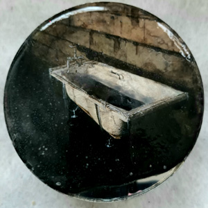  a circular painting of a bathtub