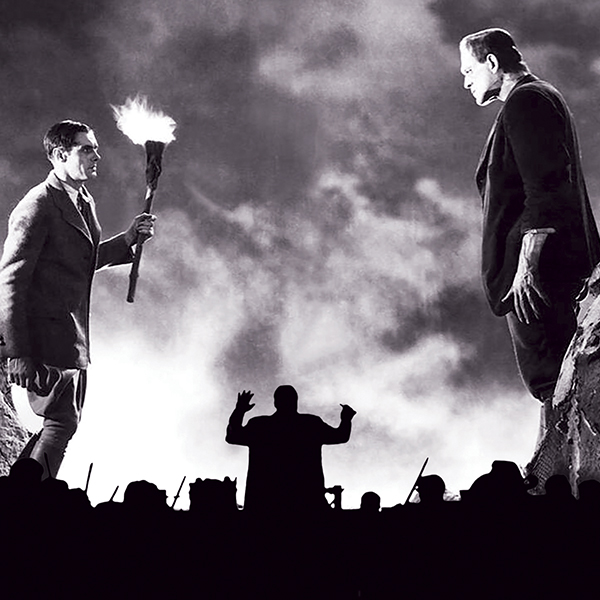 An orchestra is pictured in silhouette in front of a scene from the movie Frankenstein.