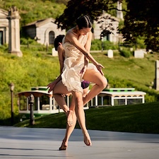 dancing still of two Jose Limón dancers outdoors